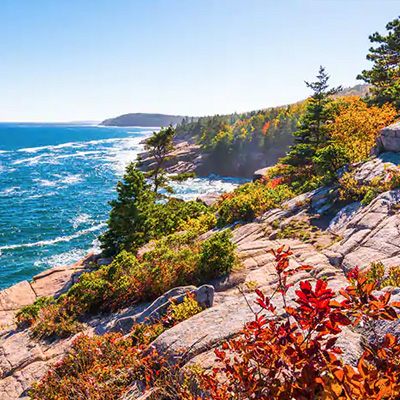 Rocky Atlantic coastline with autumn foliage, New England