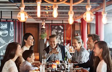 Family dining together in a cruise ship restaurant